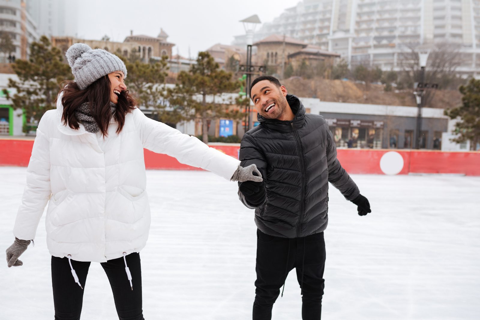 Couple skating on an outdoor ice rink