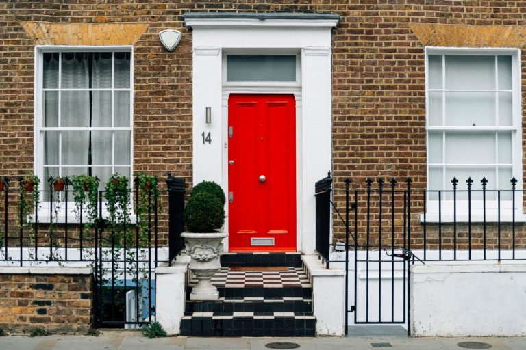 Red front door of a townhouse
