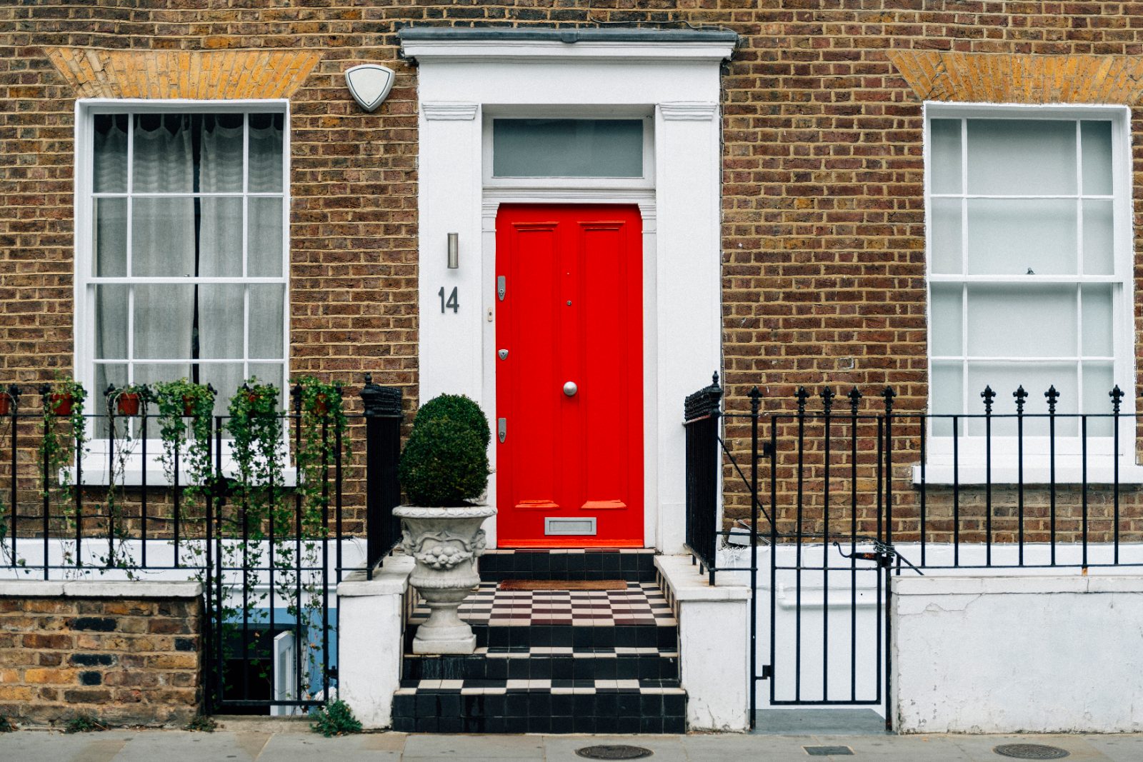 Red front door of a townhouse